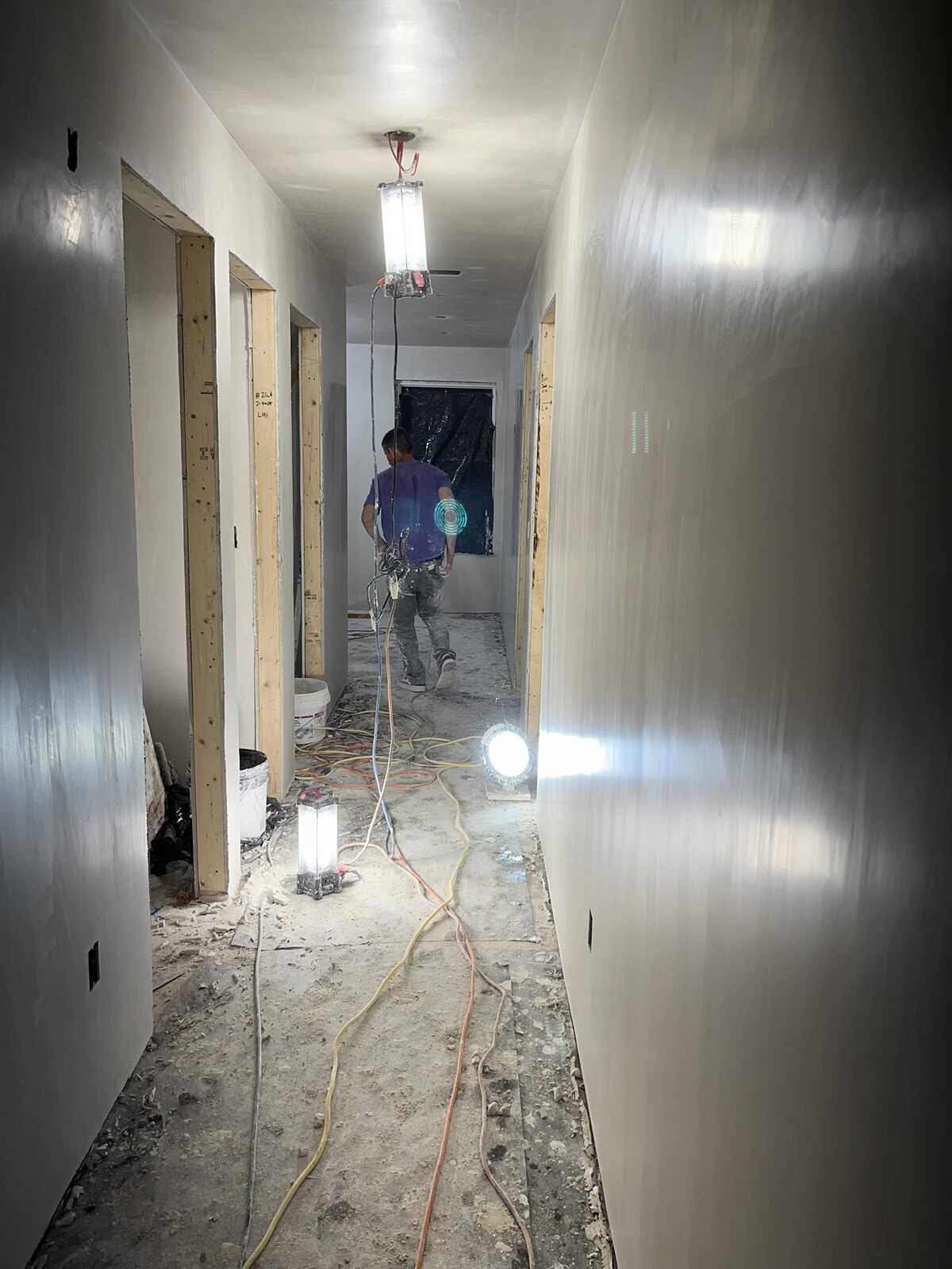 Freshly finished smooth plaster walls and ceiling in a hallway